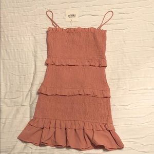 Pink ruched and frilly dress